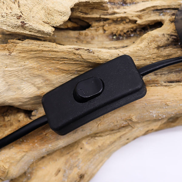 Black electronic switch on a piece of wood