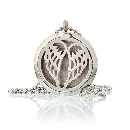 Silver pendant with angel wings design on a white background
