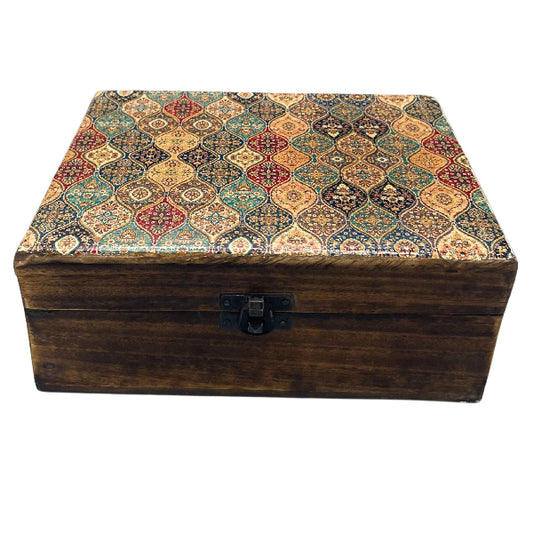 Wooden box with a patterned lid on a white background
