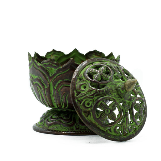 Decorative green and brown metal box with intricate designs on a white background