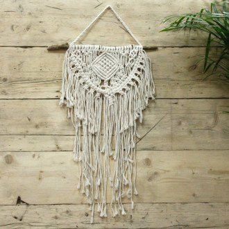 Macrame wall hanging on a wooden wall