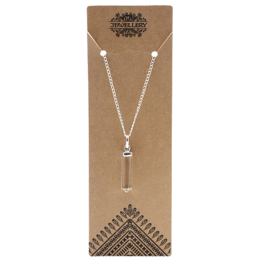 Necklace with a clear pendant on a brown jewelry card