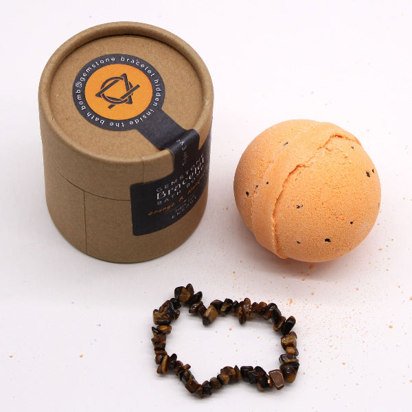 Bath bomb, bracelet, and packaging on a white background