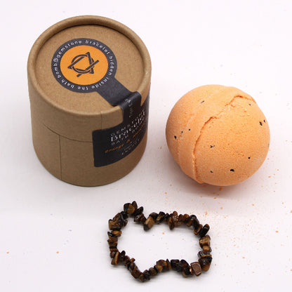 Bath bomb, bracelet, and packaging on a white background