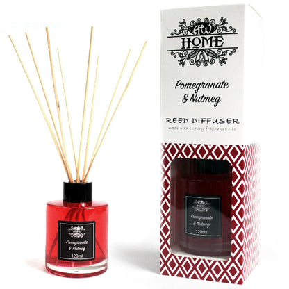Red reed diffuser with packaging labeled 'Pomegranate & Nutmeg' on a white background