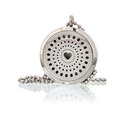 Silver pendant with heart design on a white background