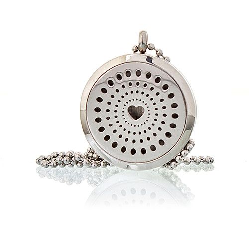 Silver pendant with heart design on a white background
