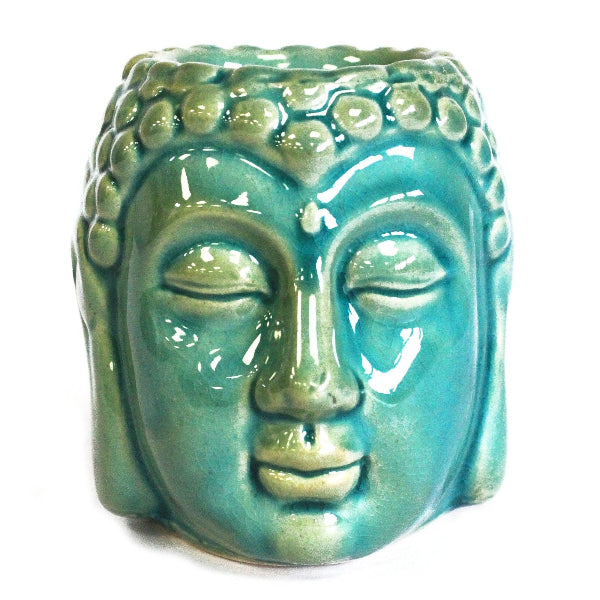 Turquoise ceramic Buddha head on a white background