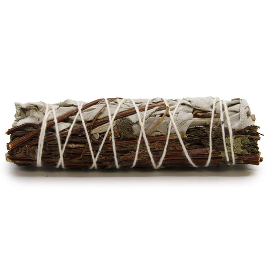 Bundled sage with twine on a white background