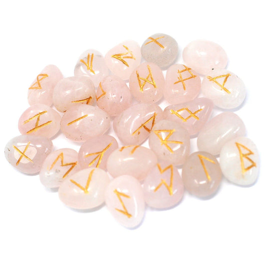Pink stones with gold runes on a white background
