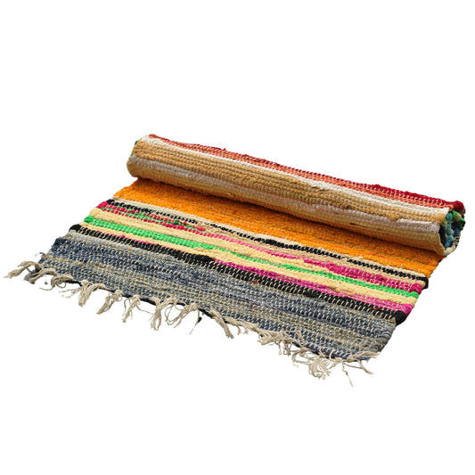 Colorful woven mat with fringes on a white background