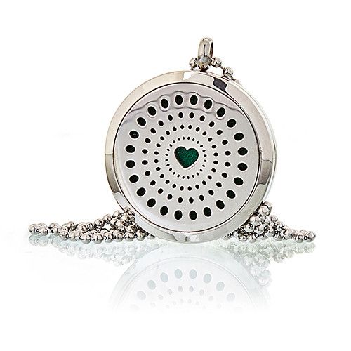 Silver locket with a green heart charm on a white background