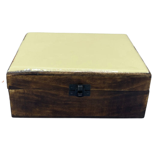 Wooden box with a metallic lid on a white background