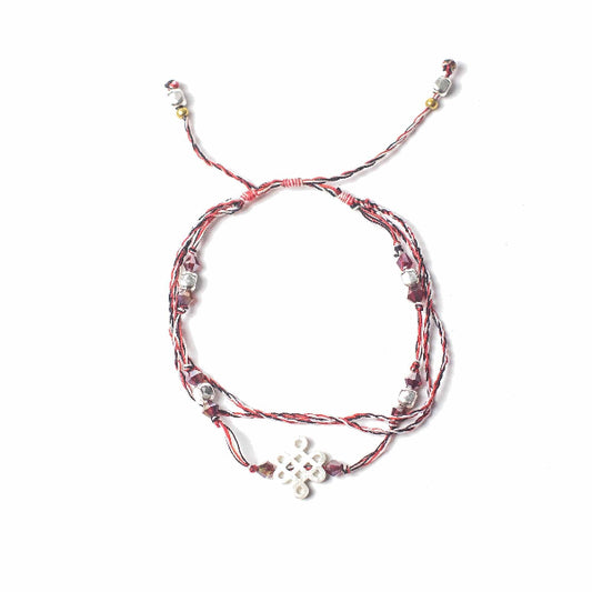 Multistrand bracelet with beads on a white background