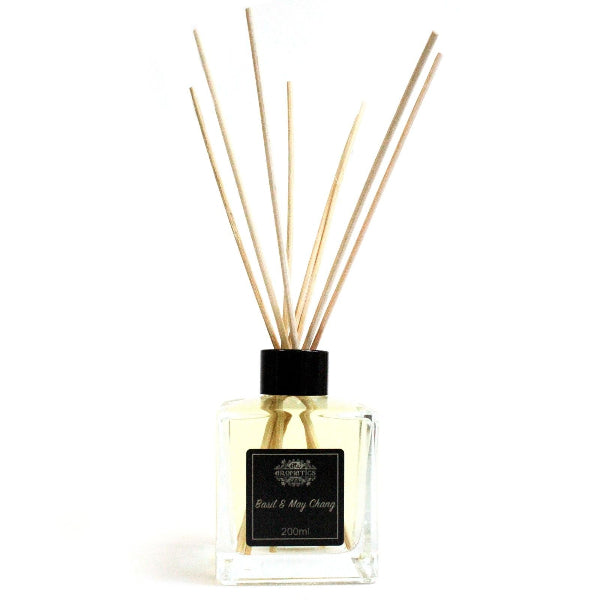 Diffuser with wooden sticks on a white background