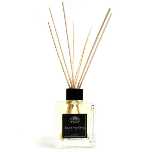 Diffuser with wooden sticks on a white background