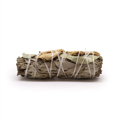 Rolled sage smudge stick with white string on a white background