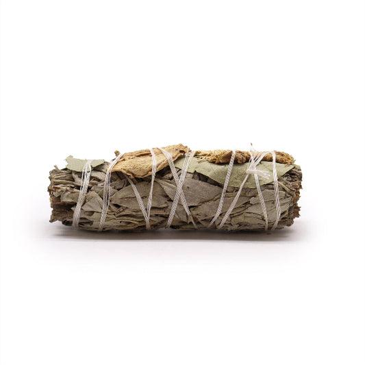 Rolled sage smudge stick with white string on a white background