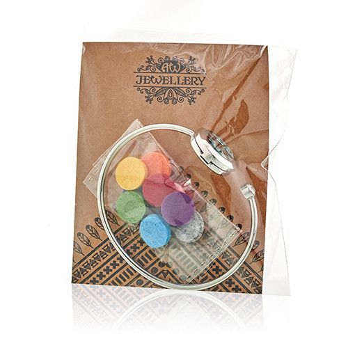 Jewelry set with colorful beads in a clear case on a branded jewelry box.
