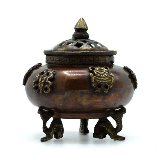 Bronze incense burner with lid on a white background