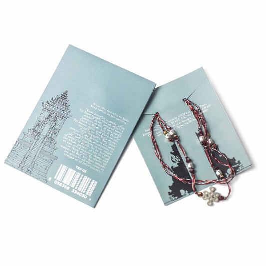 Beaded earrings on a branded card with a white background