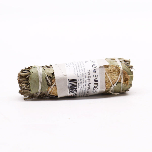 Rolled sage smudge stick with a label on a white background