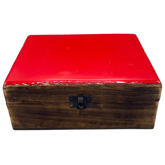 Wooden box with a red lid on a white background