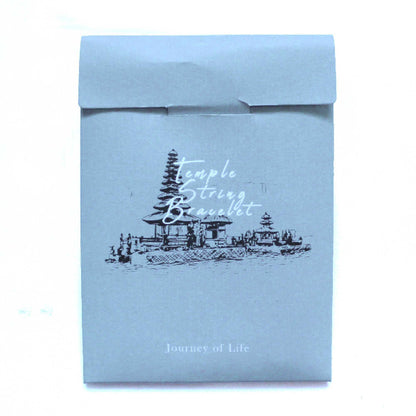 Blue packaging with 'Temple & String Bracelet' branding and design.