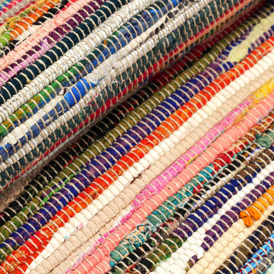 Close-up of colorful fabric swatches arranged in a pattern.