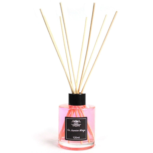Reed diffuser with wooden sticks and a black label on a white background