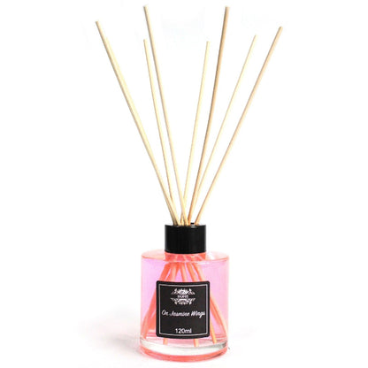 Reed diffuser with wooden sticks and a black label on a white background