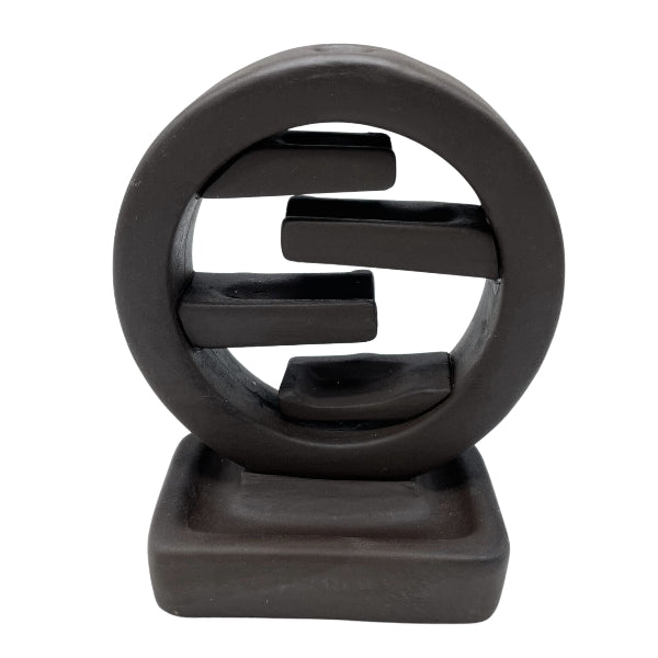 Black abstract sculpture on a white background