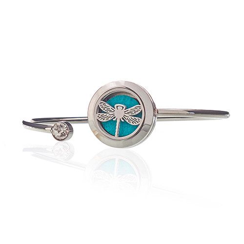Silver bracelet with a dragonfly charm on a white background
