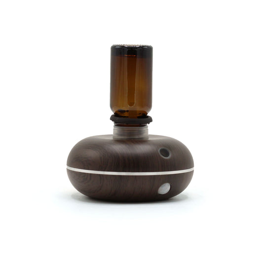 Brown and white essential oil diffuser on a white background