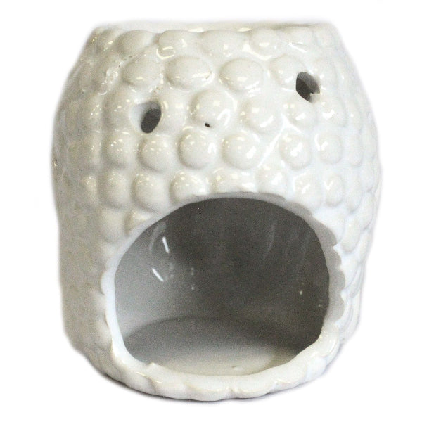 White textured ceramic oil burner on a white background