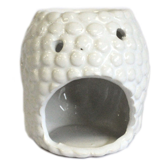 White textured ceramic oil burner on a white background