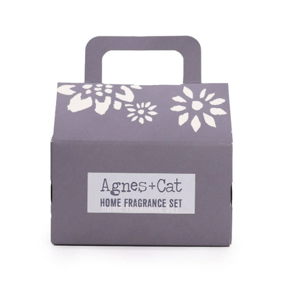 Gray box with floral designs and 'Agnes + Cat' label on a white background