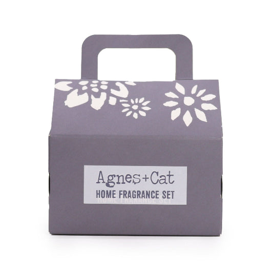 Gray box with floral designs and 'Agnes + Cat' label on a white background