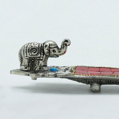 Decorative hair clip with an elephant design on a white background