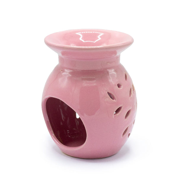 Pink ceramic oil burner on a white background