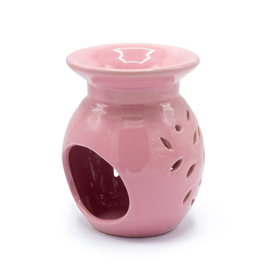 Pink ceramic oil burner on a white background