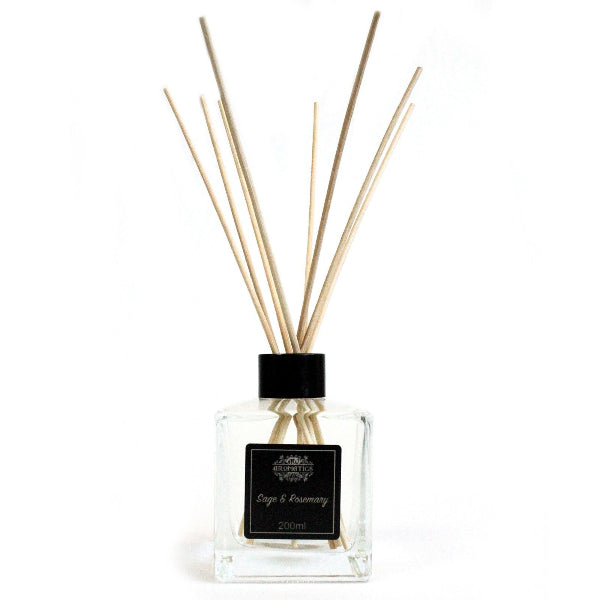 Reed diffuser with wooden sticks in a clear bottle on a white background