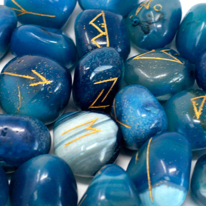 Blue stones with yellow markings on a white background
