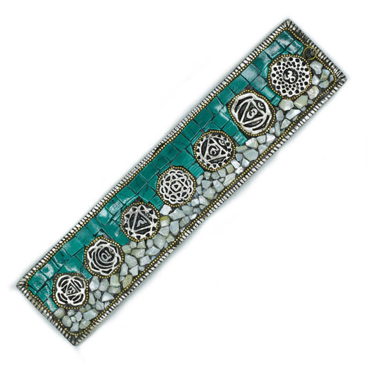 Decorative bracelet with turquoise and silver design on a white background