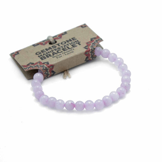 Purple beaded bracelet on a white background with a branded card behind it