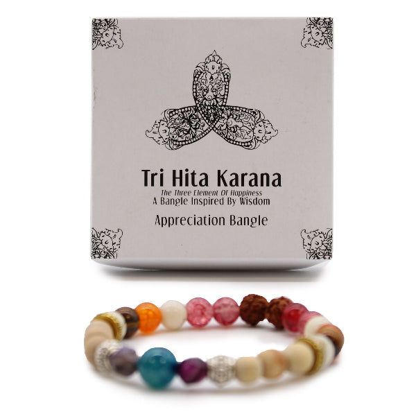 Tri Hita Karana bracelet with packaging on a white background