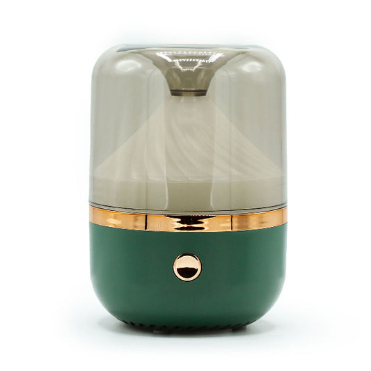 Green and gold cylindrical product on a white background