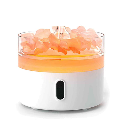 Himalayan salt lamp with pink crystals on a white background