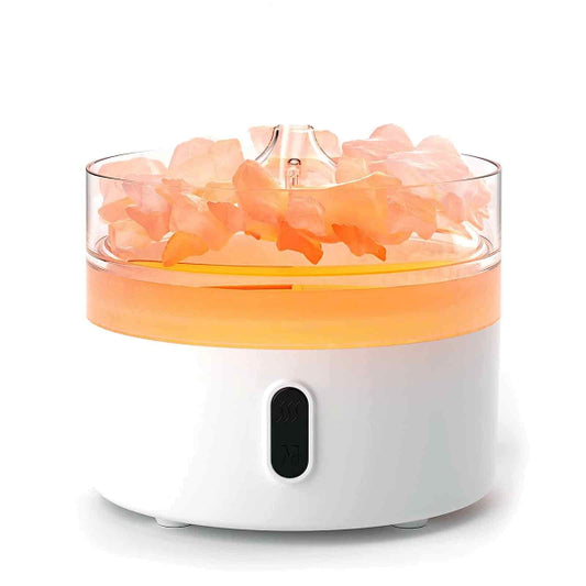 Himalayan salt lamp with pink crystals on a white background