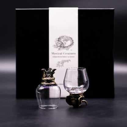 Decorative glass items with a black box labeled 'Mystical Creatures' on a dark background